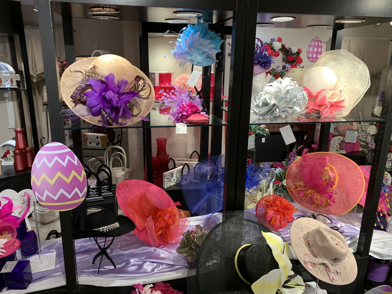 Volunteers finishing Kentucky Derby hats, fascinators for Hats On For Healing auction